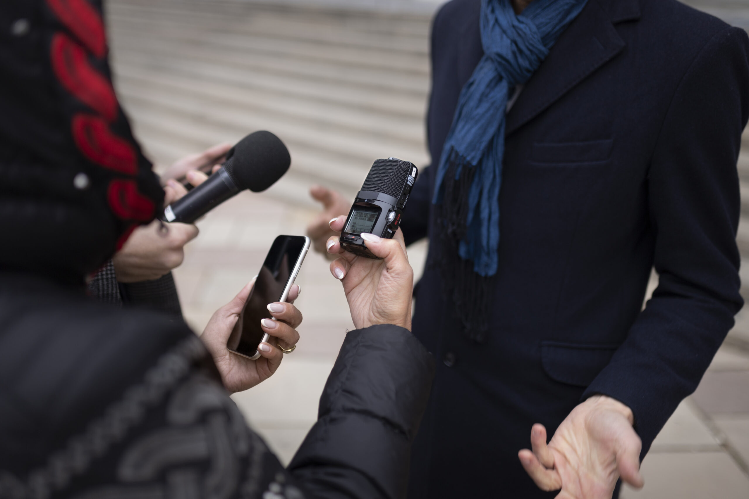 close-up-reporter-taking-interview (1)